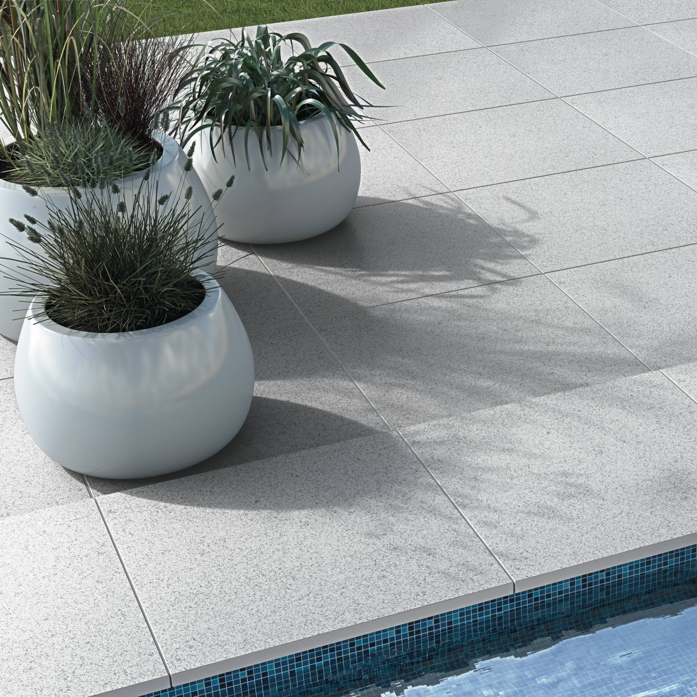 Here is a closer view of the Bradstone Pauta Porcelain Paving in the Silver Grey. You can see clean cut lines and speckled finish.
