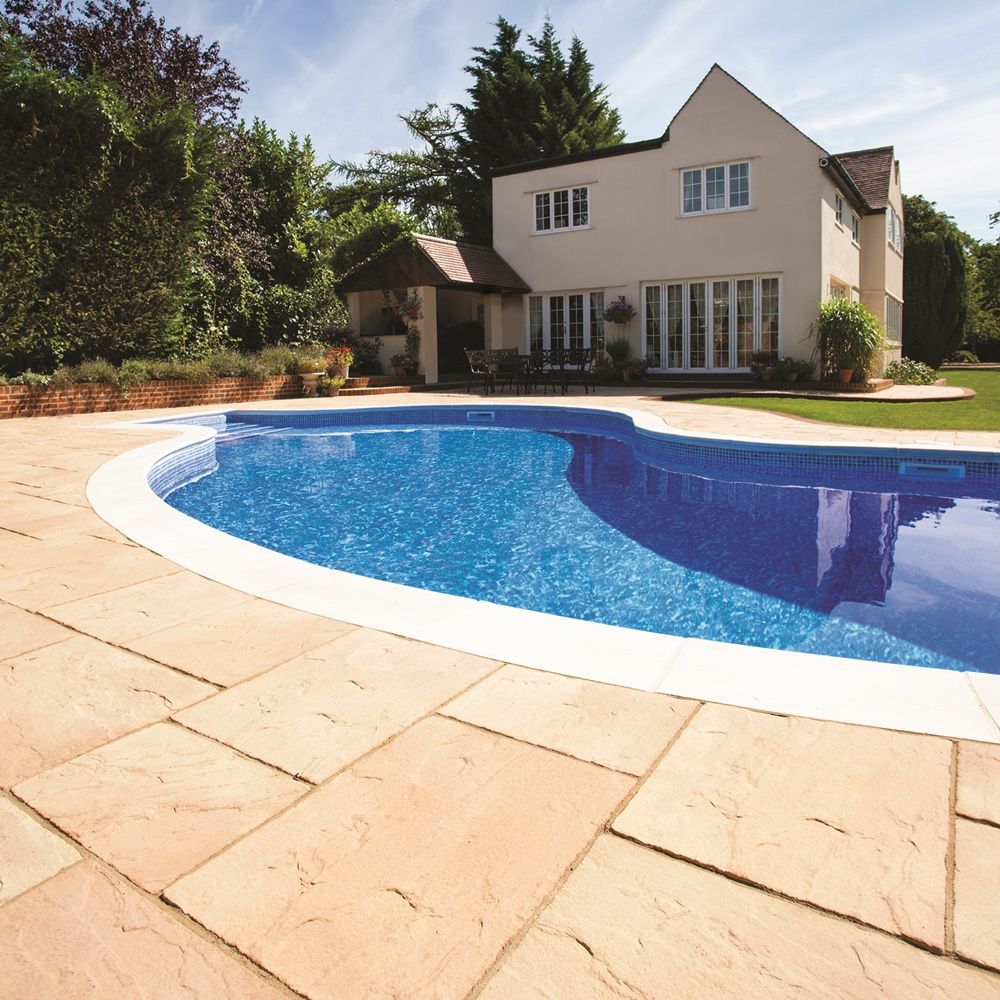 This is a stunning example of the Bradstone Ashbourne Paving Cotswold. It looks timeless around this outdoor pool area,complimenting its surroundings.