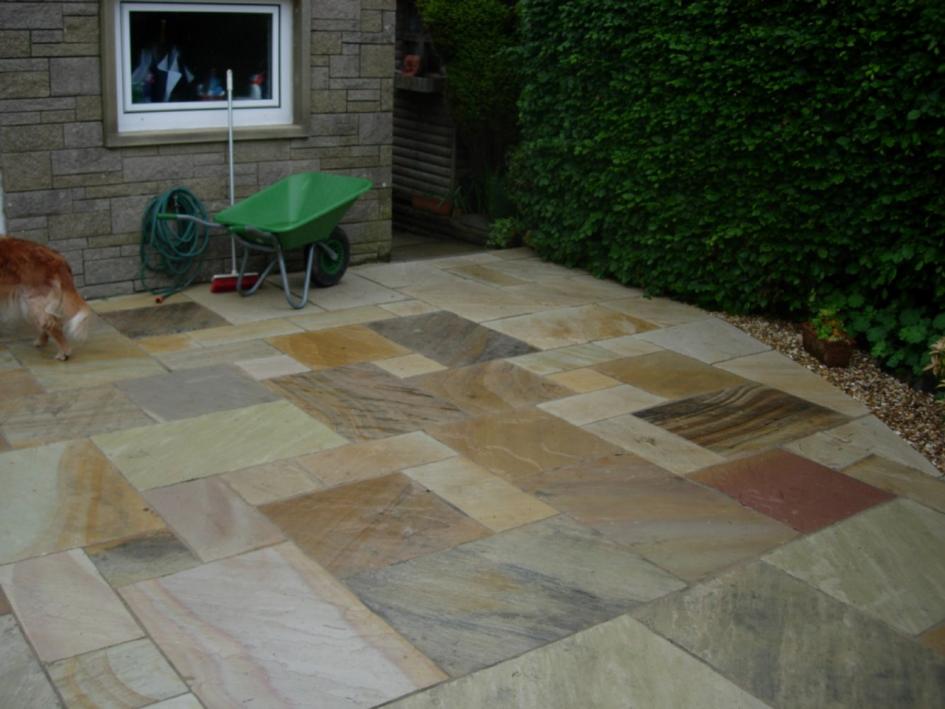 Here is a great example of the Bradstone Natural Sandstone paving in Fossil Buff. The image shows the product wet. The colours appear more vibrant and slightly darker.