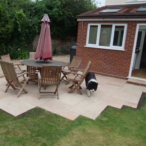 Bradstone Natural Sandstone Sunset buff in the Mixed Patio Pack creates a lovely patio for one of our customer's canine companions to enjoy!