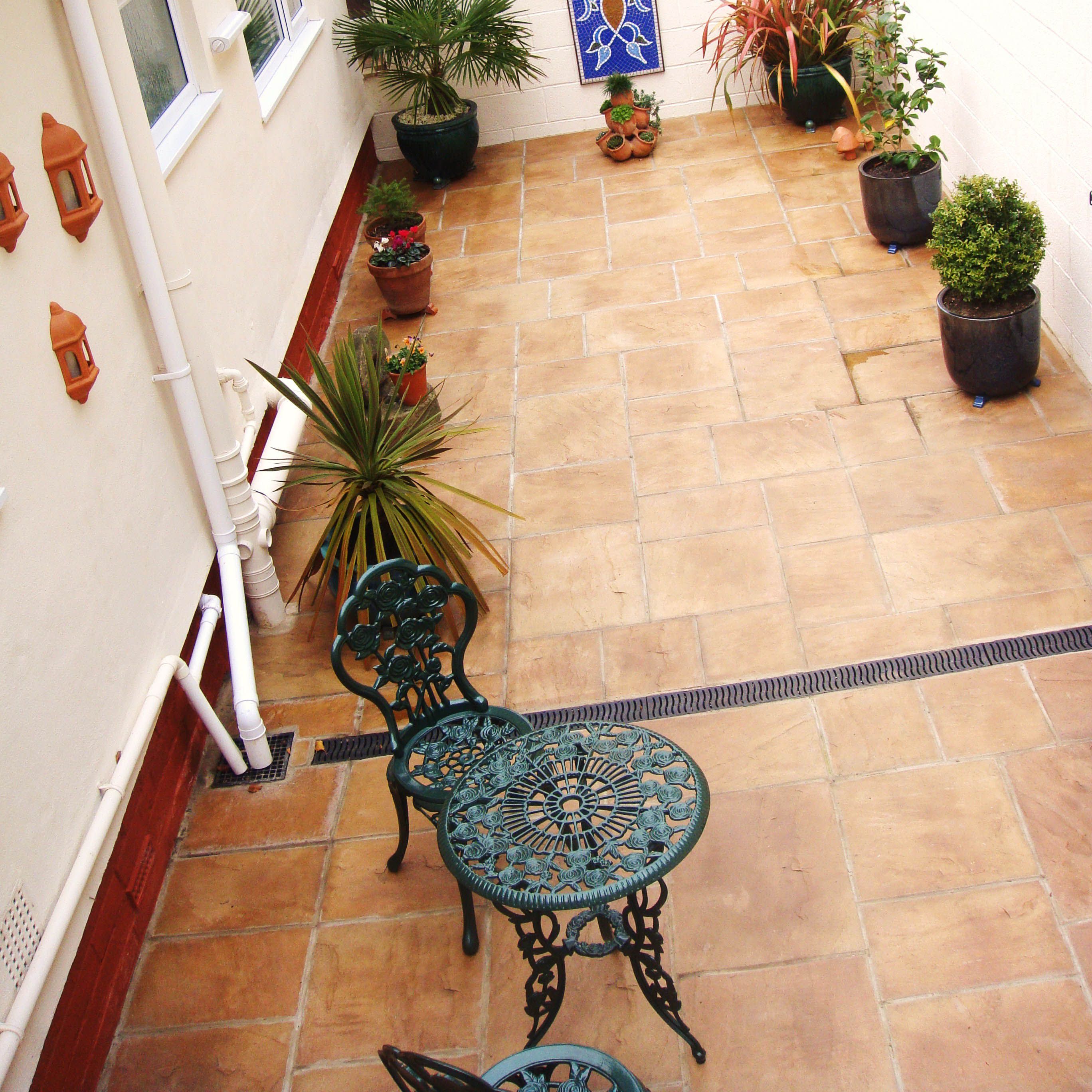 Bradstone Old Riven Paving in Autumn Cotswold is perfect for creating a rustic Mediterranean themed patio area.