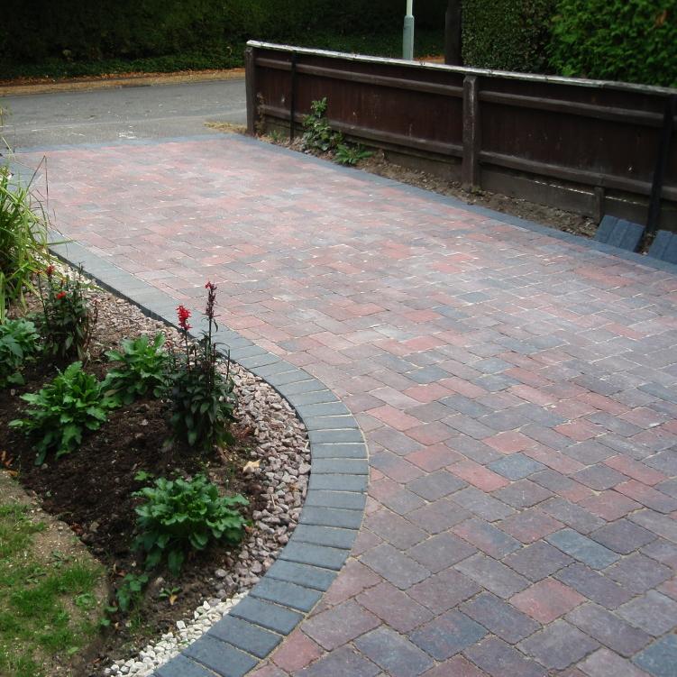 Bradstone Woburn Rumbled brings a delightful cobble style block paving to any driveway. Here you can see the Brindle shade.
